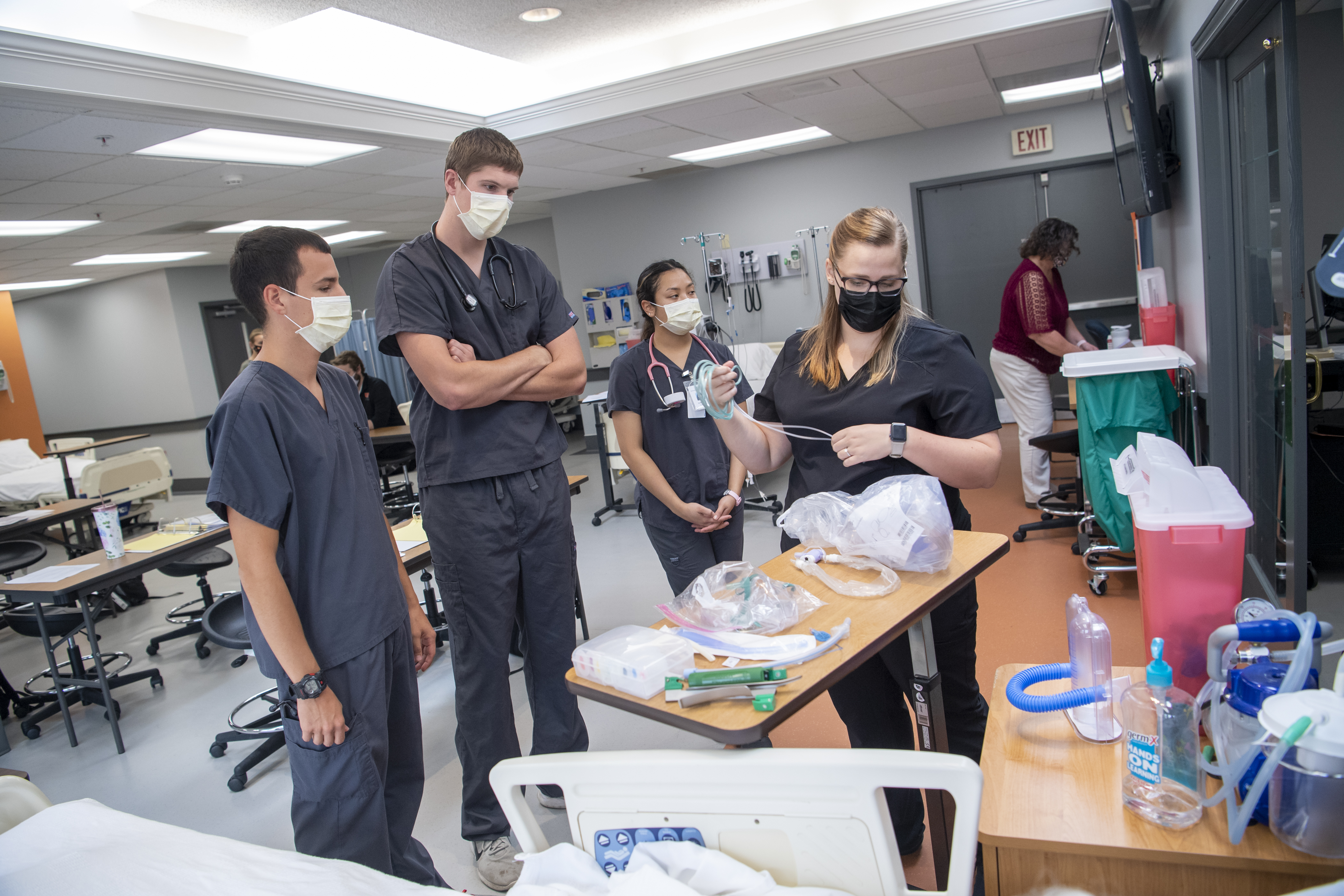 Nursing students learning hands-on.