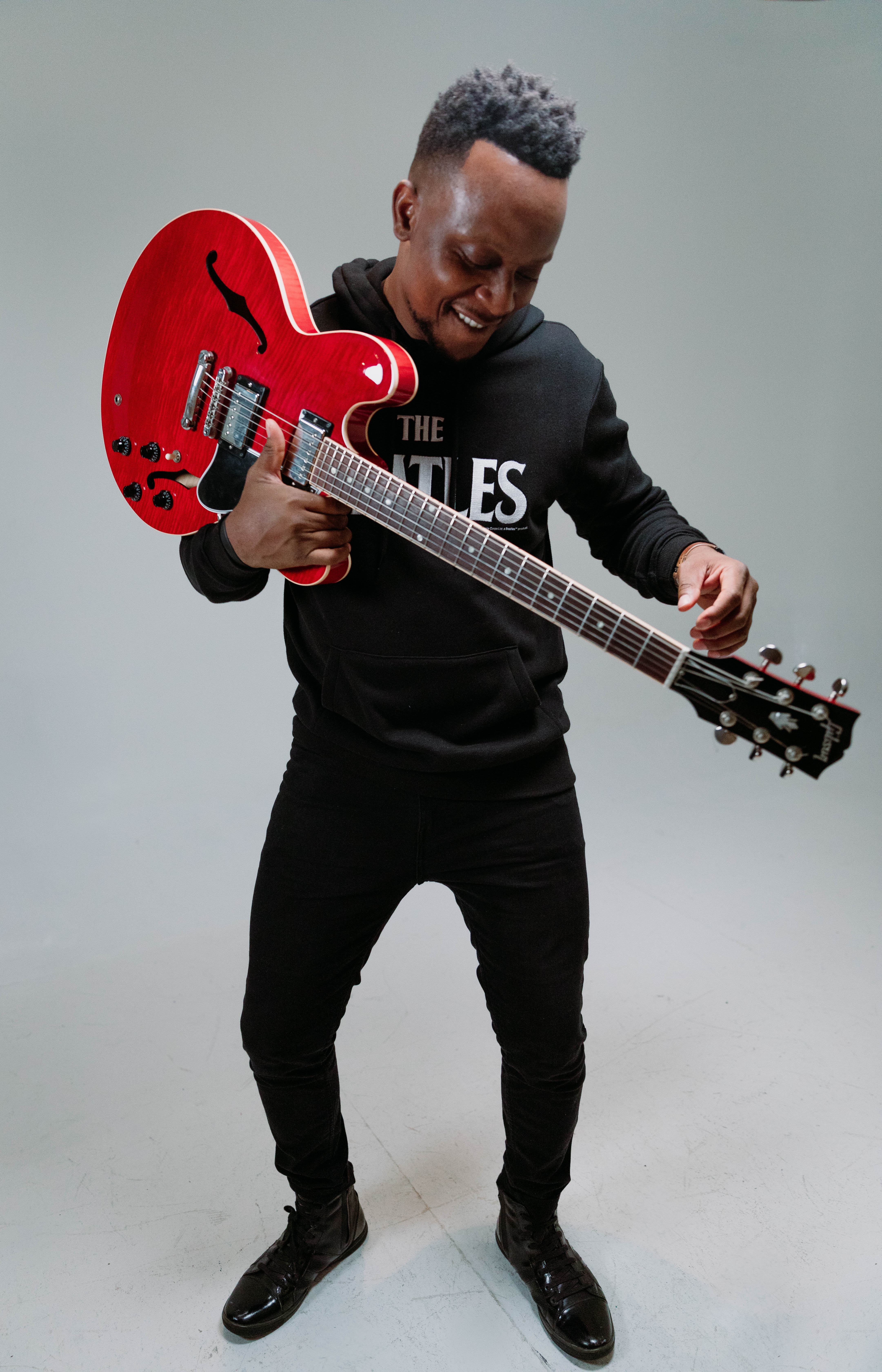 Standing with Red Guitar.jpg