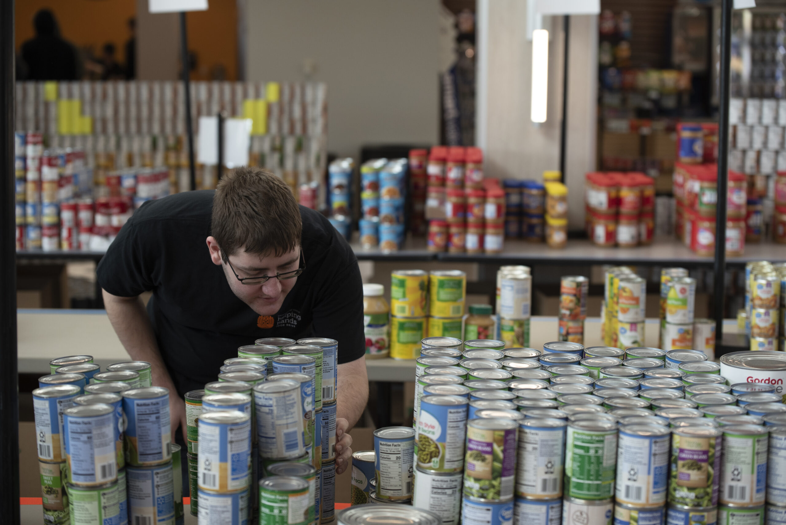Student organizing at the Helping Hands Food Drive