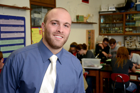 Male findlay student poses in classroom